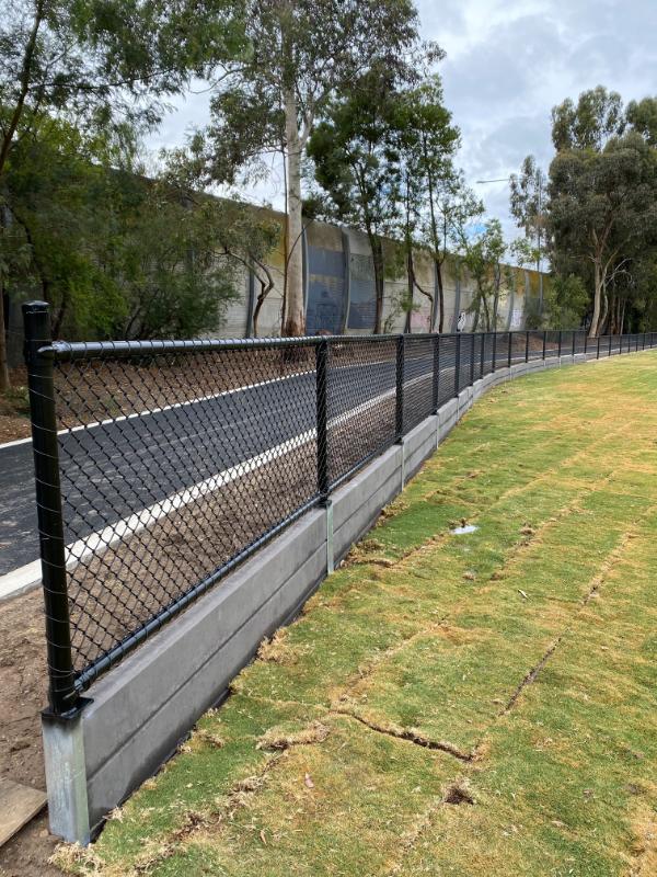 Concrete Sleepers and Galvanized Steel Retaining Wall at a sports ground.